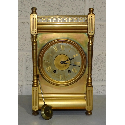 8 - A brass-cased mantel clock with galleried top, the movement striking on a gong, 30.5cm high, 17cm wi... 