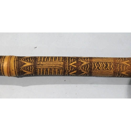 103 - A carved bamboo staff with metal double-headed figural terminal, 167cm high, together with a horn-ha... 