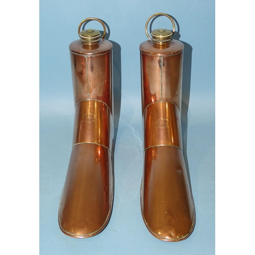 113 - A pair of copper boot warmers, Army & Navy, London, each with brass hanging loop and screw cap, ... 