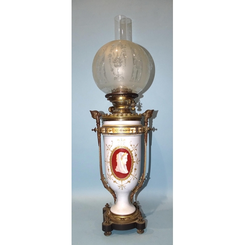 117 - A Victorian gilt metal and opaque glass oil lamp decorated with female cameos, having later etched g... 