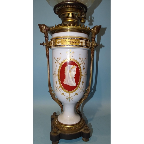 117 - A Victorian gilt metal and opaque glass oil lamp decorated with female cameos, having later etched g... 