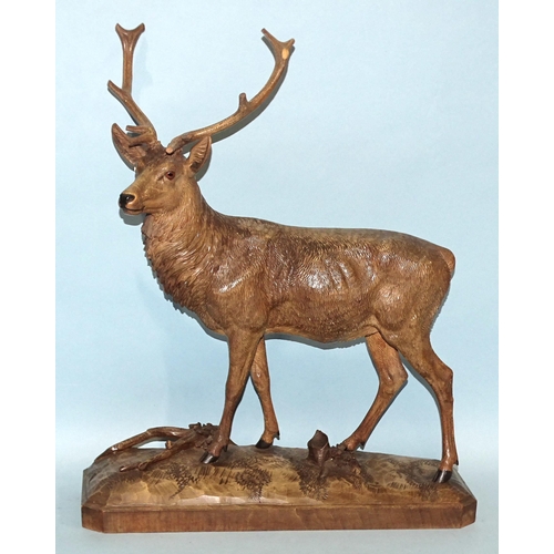 118 - Geschw, Flück, an early-20th century Black Forest carving in the form of a standing stag, 56cm high,... 