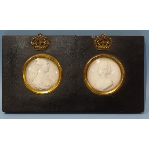 123 - A pair of ceramic relief bust intaglios depicting European monarchs, framed as one, 12.5 x 23cm.... 