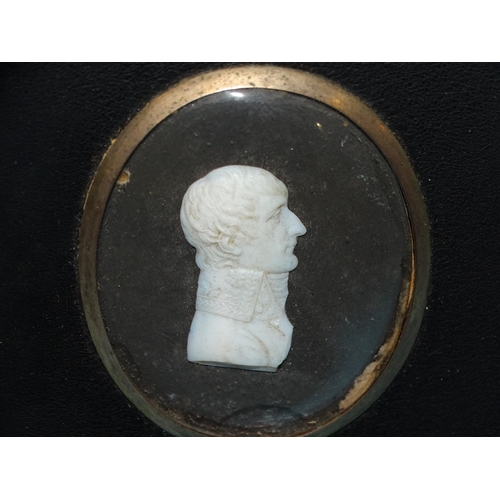 124 - Two ceramic relief bust miniatures, possibly Roman subjects and another of the Duke of Wellington, 5... 