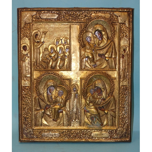 127 - An antique Russian four-field icon, painted beneath a pressed gilt metal oklad, 31.5 x 27cm.... 