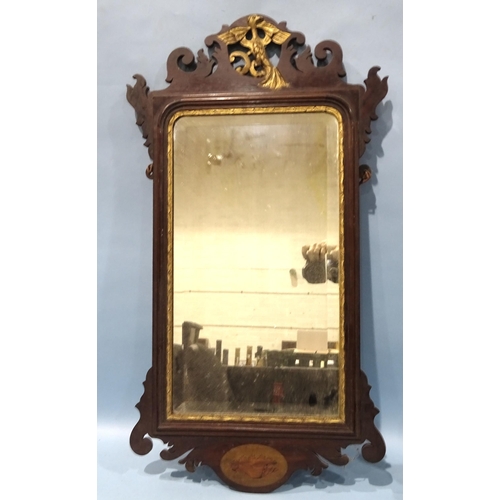 131 - A Georgian mahogany and parcel gilt bevelled plate wall mirror, inlaid with shell motif, 92 x 49cm.... 