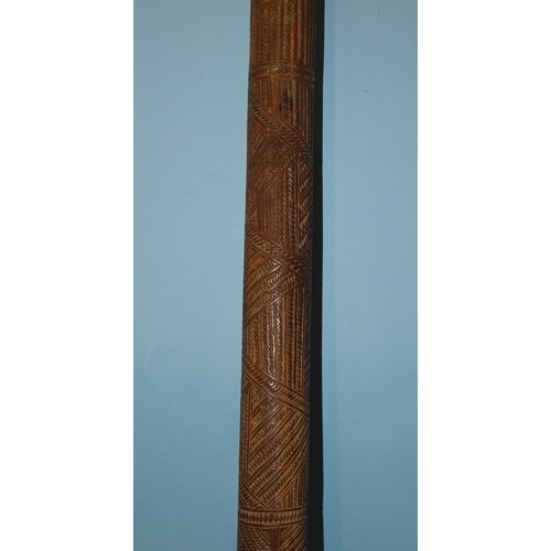 133 - A Polynesian Aku Pouai iron wood pole club of slightly-tapering form, with overall zigzag carved dec... 