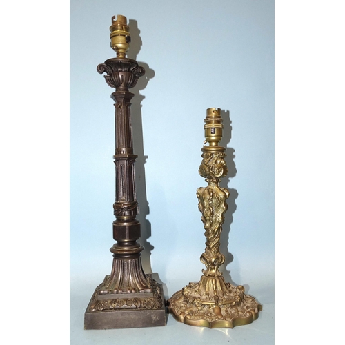 135 - *Please note, all starred lots are sold at no reserve.*A bronze table lamp with urn sconce, on secti... 