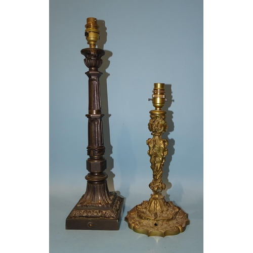 135 - *Please note, all starred lots are sold at no reserve.*A bronze table lamp with urn sconce, on secti... 