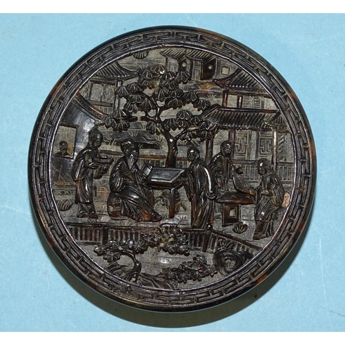 141 - A Chinese export circular tortoiseshell box deeply-carved with figures amidst pavilions and trees, f... 