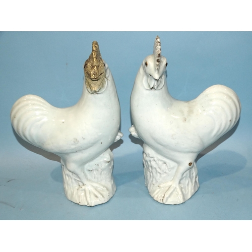 153 - A pair of Chinese export porcelain cockerels, one with restored comb and beak, 31cm high, (2).... 