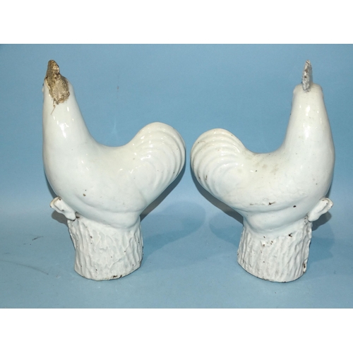 153 - A pair of Chinese export porcelain cockerels, one with restored comb and beak, 31cm high, (2).... 