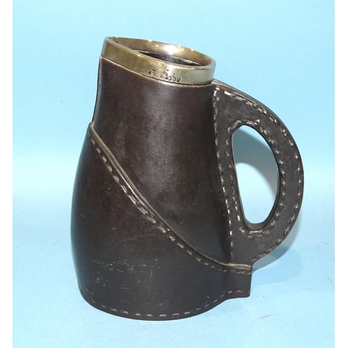 158 - A Doulton Lambeth ceramic leather jack-style jug with silver mounts, 16.5cm high.