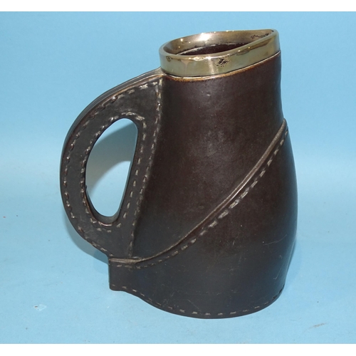 158 - A Doulton Lambeth ceramic leather jack-style jug with silver mounts, 16.5cm high.