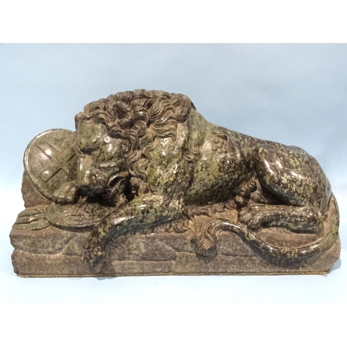 142 - A carved serpentine sculpture of the Lion of Lucerne after Bertel Thorvaldsen, 48cm long, 25cm high,... 