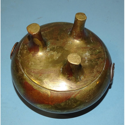 140 - An Oriental bronze censer with floral bosses, 12.5cm diameter, 9.5cm high.