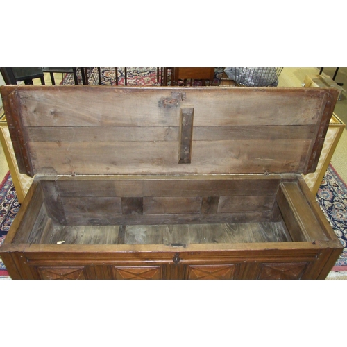 26 - An antique Continental elm coffer with metal-studded detail and panelled front, 182cm long, 60cm hig... 