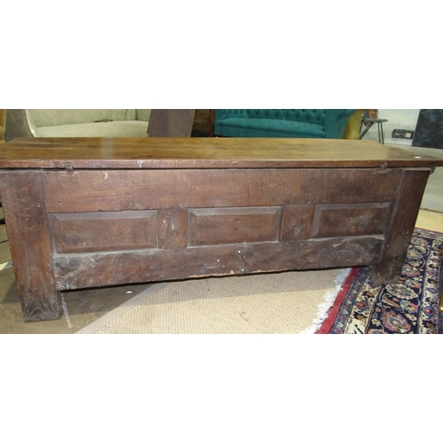 26 - An antique Continental elm coffer with metal-studded detail and panelled front, 182cm long, 60cm hig... 