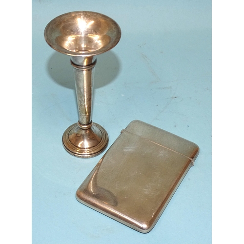 507 - A George V silver card case of plain form, 10 x 7cm, (hinge a/f) and a small silver spill vase, 12cm... 