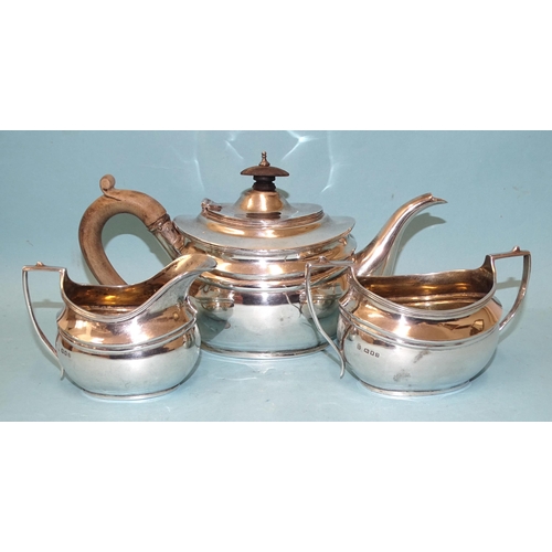 531 - A George V silver three-piece bachelors tea service of plain compressed oval form, maker's marks rub... 