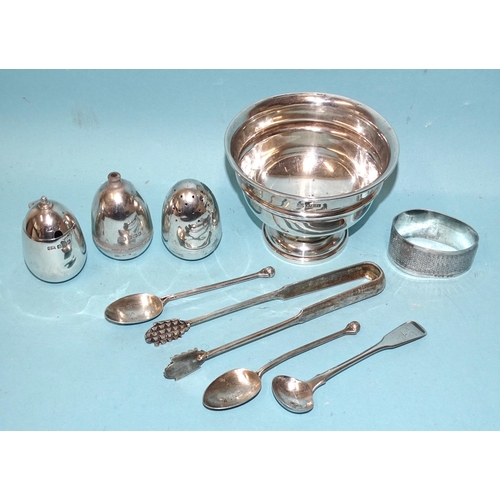 534 - A circular silver bowl raised on circular foot, Birmingham 1962, a three-piece silver cruet with wei... 