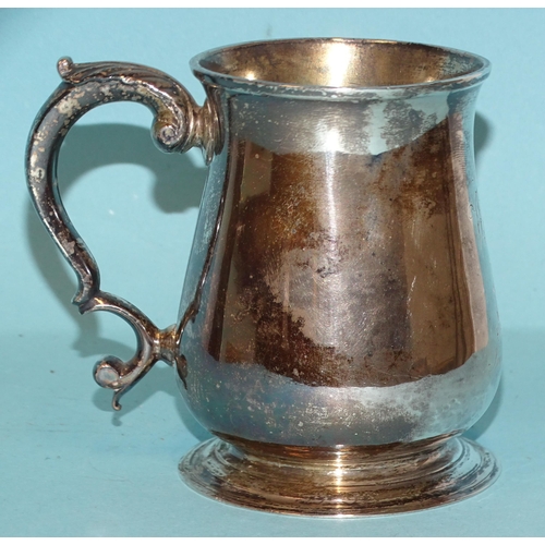 564 - A George II silver half-pint tankard of baluster form, with leaf-capped scroll handle, inscribed mak... 