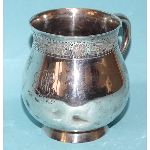 574 - A small silver tankard of bulbous form, with etched decorative border to top, inscribed monogram and... 