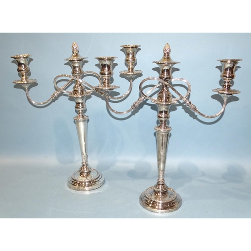 637 - A pair of large silver-plated three-branch candelabra, 49.5cm high, (2).