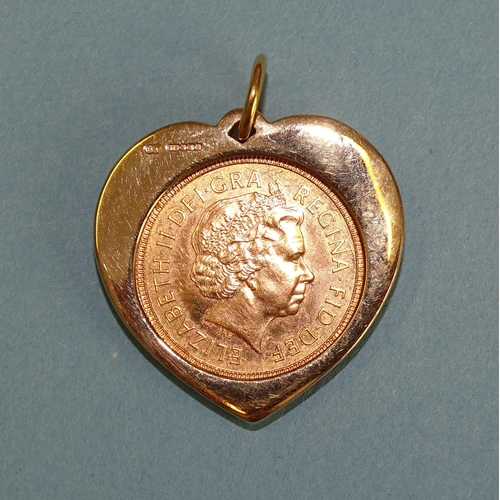 651 - A 2001 half-sovereign mounted in a 9ct gold heart-shaped pendant mount, 7g.