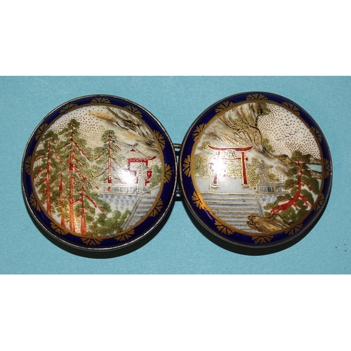 795 - A Japanese Satsuma porcelain two-piece buckle, each circular plaque depicting buildings, torii gate ... 