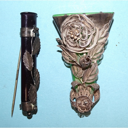 798 - A white metal boutonniere or buttonhole holder, the green glass holder of flattened conical form, wi... 