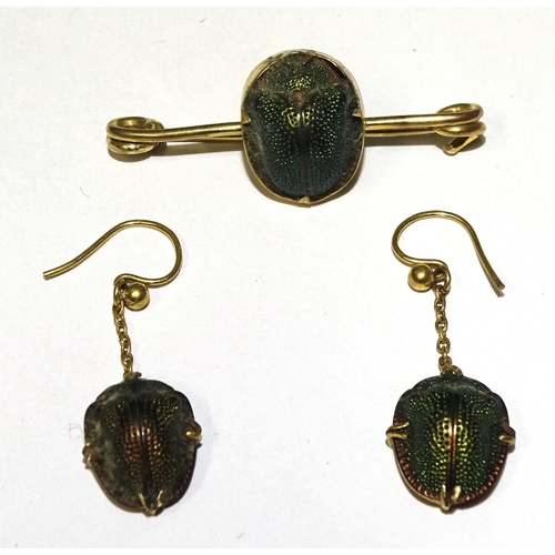 834 - A 9ct gold bar brooch set a scarab beetle and a pair of unmarked yellow-metal-mounted scarab beetle ... 