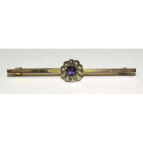 902 - A gold bar brooch set an amethyst and pearl cluster, indistinct gold marks, tested as 14/15ct approx... 