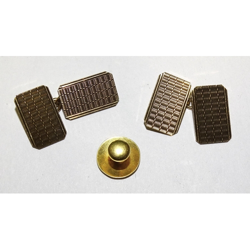 908 - A pair of 9ct gold engine-turned cufflinks, 4.2g and an 18ct gold dress stud, 0.9g, (2).... 