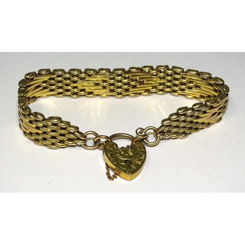 917 - A 9ct gold bracelet of textured and smooth links, arranged in a chevron pattern, with padlock clasp,... 