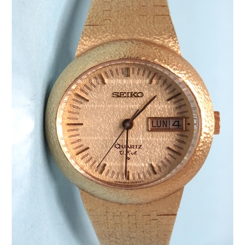 697 - Seiko, a 1970's quartz V.F.A. 18ct gold wrist watch, 3823-5005, the oval textured dial with baton nu... 