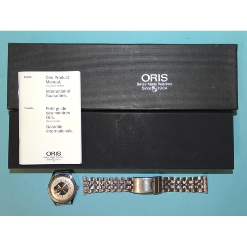 698 - Oris, an automatic steel-cased gentleman's wrist watch, ref: 7461, the navy blue/silver two-tone dia... 