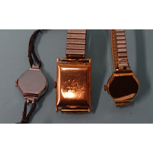 699 - A vintage 9ct gold rectangular tank-cased wrist watch, the silvered dial with Arabic numerals and se... 