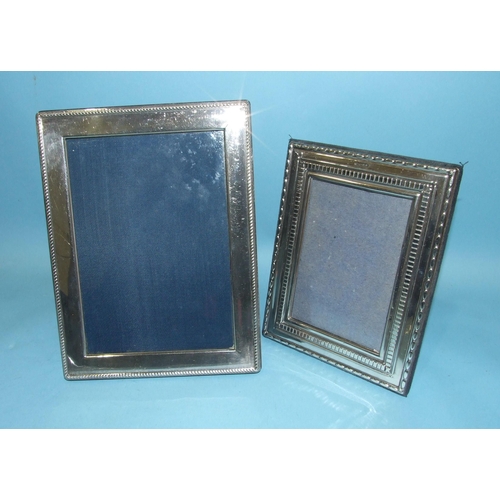 524 - A modern silver photograph frame of plain form, with reeded edge, 22 x 17cm, Sheffield 1994 and a sm... 