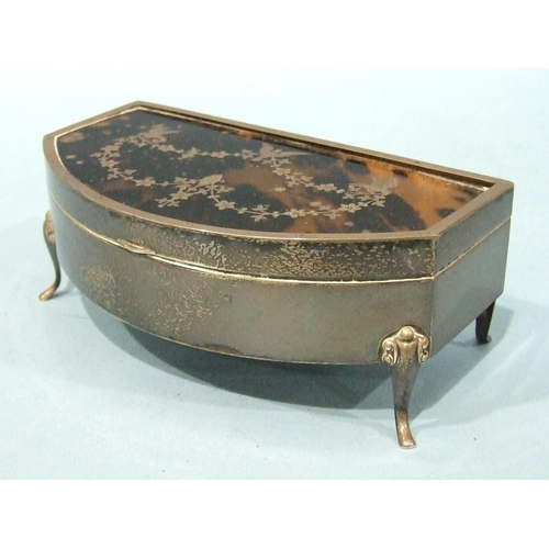 552 - A silver and tortoiseshell trinket box, bow-fronted and raised on four scroll legs, the lid with piq... 