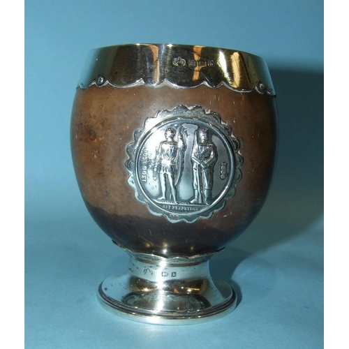 557 - An Edward VII silver-mounted coconut National Rifle Association prize cup, maker Elkington & Co,... 