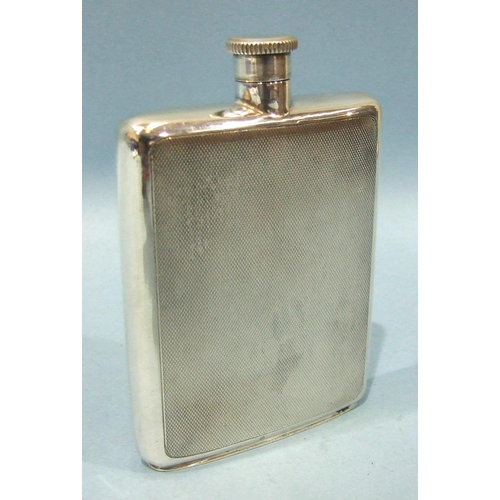 558 - An engine-turned silver hip flask with screw top, Birmingham 1970, 12 x 8 x 1.5cm, 140g, ___4.51oz.... 