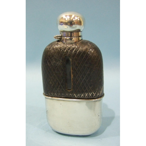 560 - A Victorian leather-covered glass hip flask with silver captive bayonet top and cup, makers James Di... 