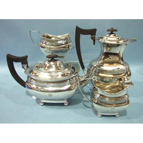 561 - A 20th century four-piece silver tea service of bellied and reeded form, raised on four ball feet, b... 