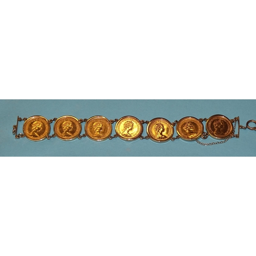 655 - A 9ct gold bracelet set seven half-sovereigns, all 1982, total weight 38.8g.