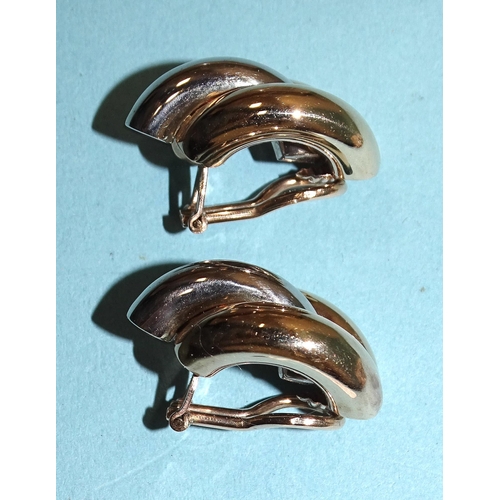 100 - A pair of 9ct yellow and white gold ear clips, 7.7g.