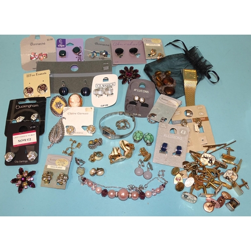 111 - A quantity of silver and costume jewellery, much in boxes and a quantity of crowns and other coins.... 