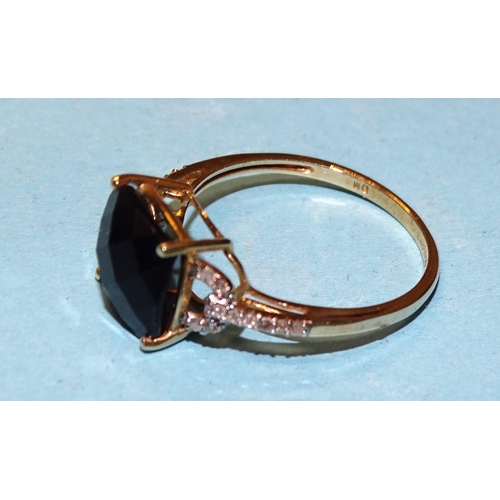 114 - A 14k yellow gold ring set onyx between diamond-set shoulders, size T, 2.7g.