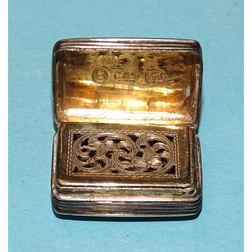 189 - A small silver cushion-shaped vinaigrette with pierced grill and engraved decoration, 2.5 x 1.5cm, B... 