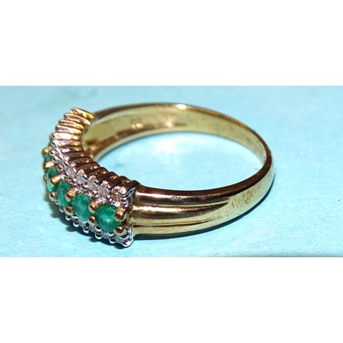 176 - A 9ct gold ring claw-set seven round-cut emeralds between two lines of thirteen each diamonds, size ... 